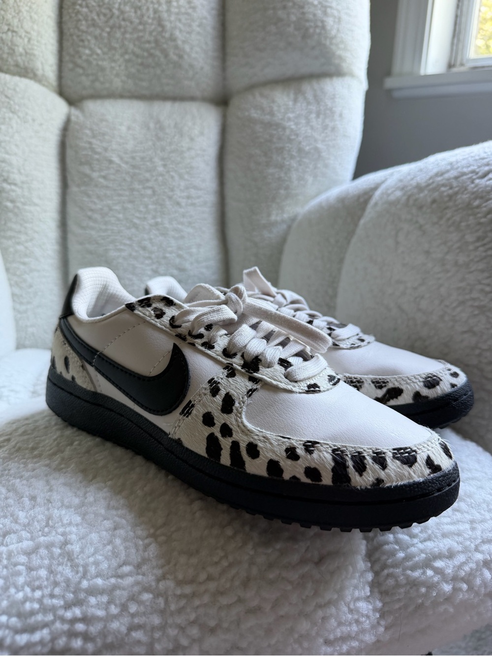 Nike White Low-Top Sneakers with Black Swoosh and Dalmatian Spot Accents